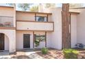 Charming two-story townhome with a private front entrance and landscaping at 5241 Janfred Ct # 18, Las Vegas, NV 89103