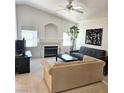 Bright living room featuring high vaulted ceilings, fireplace, and a cozy seating arrangement at 5415 W Harmon Ave # 2094, Las Vegas, NV 89103