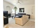 Bright living room featuring high vaulted ceilings, fireplace, and a cozy seating arrangement at 5415 W Harmon Ave # 2094, Las Vegas, NV 89103