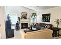 Cozy living room features vaulted ceiling, fireplace, and lots of natural light at 5415 W Harmon Ave # 2094, Las Vegas, NV 89103