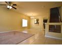 Open-concept living space with large windows and easy access to staircase at 6339 Sharp Rock Ct, Las Vegas, NV 89139
