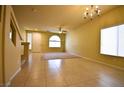 Bright, open living area with tile floors and a ceiling fan at 6339 Sharp Rock Ct, Las Vegas, NV 89139