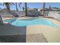Inviting pool surrounded by lush landscaping, perfect for relaxation and outdoor entertainment at 6842 Greengrove Dr, Las Vegas, NV 89103