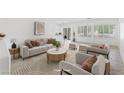 Bright living room with modern furniture, neutral tones and lots of natural light at 7448 Lintwhite St, North Las Vegas, NV 89084