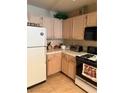 Well-equipped kitchen with neutral cabinetry and tiled backsplash, ready for culinary adventures at 7950 W Flamingo Rd # 2074, Las Vegas, NV 89147
