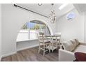 Cozy living room with vaulted ceilings, an arched window, and comfortable seating at 1520 Della Ct, Boulder City, NV 89005