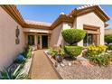 Inviting front entrance with well-maintained landscaping and charming walkway at 2521 Roseworthy Dr, Las Vegas, NV 89134