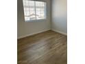 Cozy bedroom with natural light and hardwood floors at 2528 Sierra Bello Ave # 103, Las Vegas, NV 89106
