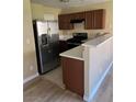 Well-lit kitchen featuring stainless steel appliances and sleek countertop at 2528 Sierra Bello Ave # 103, Las Vegas, NV 89106