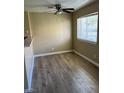 Bright living room featuring ample natural light and modern hardwood flooring at 2528 Sierra Bello Ave # 103, Las Vegas, NV 89106