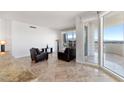 Light filled living room featuring tile floors, modern furniture and access to an outdoor terrace at 2777 Paradise Rd # 2605, Las Vegas, NV 89109