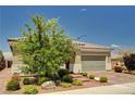 Charming single-story home with a well-maintained front yard and a brick driveway at 2902 Ventana Ridge Ave, Henderson, NV 89044