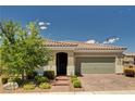 Inviting single-story home with landscaped front yard and a two car garage at 2902 Ventana Ridge Ave, Henderson, NV 89044