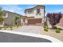 Charming home with a manicured yard, paved driveway, and a two-car garage at 3002 Coveri Ct, Las Vegas, NV 89141