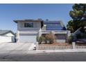Charming two-story home with stucco exterior, solar panels, and desert landscaping at 3061 Brockington Dr, Las Vegas, NV 89120