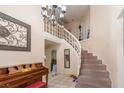 Inviting foyer with staircase and decorative chandelier at 3061 Brockington Dr, Las Vegas, NV 89120