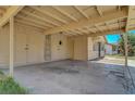 Covered parking area featuring storage and direct house access, protecting vehicles from the elements at 3630 N Pecos Rd, Las Vegas, NV 89115
