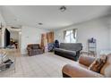 Spacious living room with tile flooring and natural light, furnished with couches and accent chairs at 3630 N Pecos Rd, Las Vegas, NV 89115