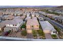 Lovely aerial view of neighborhood home with mature landscaping and a stone driveway at 390 Coastal Redwood St, Las Vegas, NV 89138