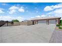 Spacious three car garage adjacent to the house with secure gated access at 4455 W Ford Ave, Las Vegas, NV 89139