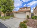 Well-maintained two-story home featuring a two-car garage and desert landscaping at 5452 Big Sky Ln, Las Vegas, NV 89149