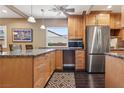 Modern kitchen featuring stainless steel appliances, granite countertops, and custom cabinets with sleek hardware at 639 I Ave, Boulder City, NV 89005