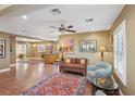 Spacious living room with hardwood floors, a ceiling fan, and neutral paint, perfect for comfortable living at 639 I Ave, Boulder City, NV 89005