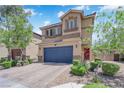 Attractive two-story home with a blue garage door, complemented by lush green landscaping, and stone accents at 6626 Seahorse Reef St, Las Vegas, NV 89149