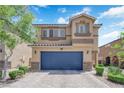 Charming two-story home showcasing a blue garage door, complemented by stone accents and manicured landscaping at 6626 Seahorse Reef St, Las Vegas, NV 89149