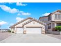 Inviting home with a two-car garage and low-maintenance desert landscaping at 82 Autumn Day St, Henderson, NV 89012