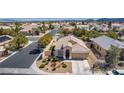 Beautiful home with a well-manicured lawn and mature landscaping in a quiet suburban neighborhood at 8266 Lincoln Valley St, Las Vegas, NV 89123