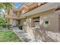 Close up of front entrance featuring a covered porch and manicured lawn at 8591 Heather Downs Dr, Las Vegas, NV 89113
