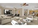 Bright and airy living room featuring an open floor plan and stylish furniture at 8913 Loggers Mill Ave, Las Vegas, NV 89143