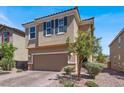 Two-story home with a paved driveway and a two-car garage at 9198 Harbin Ave, Las Vegas, NV 89148