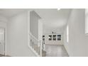 Bright hallway with tile flooring, staircase, and lots of natural light at 9198 Harbin Ave, Las Vegas, NV 89148