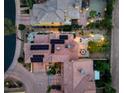 Drone shot of a home featuring solar panels, beautiful landscaping, and an outdoor dining area with a pergola at 1 Cerchio Basso, Henderson, NV 89011
