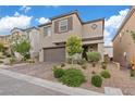 Charming two-story home featuring a brick driveway and well-manicured landscaping at 10324 Stroma Ave, Las Vegas, NV 89166