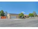 Inviting single-story house with a well-kept front yard, solar panels and an attached garage at 1560 Arabian Dr, Henderson, NV 89002
