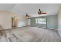 Bright living room features fresh paint, new carpet, and an abundance of natural light at 1560 Arabian Dr, Henderson, NV 89002