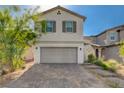 Charming two-story home with a two-car garage and paved driveway at 1637 Harvest Pecan Ct, Las Vegas, NV 89108