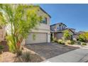 Charming two-story home with a two-car garage and paved driveway at 1637 Harvest Pecan Ct, Las Vegas, NV 89108