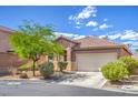 Attractive single-story home with well-kept landscaping, a driveway, and a two-car garage at 2920 Riarosa Ct, North Las Vegas, NV 89086
