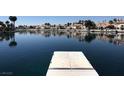 Picturesque water view showing calm lake reflecting houses under blue skies from a dock at 3005 Treasure Island Rd, Las Vegas, NV 89128