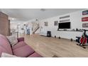 Open-concept living room with hardwood floors and plenty of natural light at 3018 Burnham Ave, Las Vegas, NV 89169