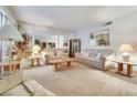 Inviting living room with neutral decor, mirrored walls, and plenty of space for furniture arrangement and personalization at 3553 Kensbrook St, Las Vegas, NV 89121