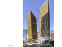 Modern high-rise condo building with stunning yellow glass exterior and city views at 3726 Las Vegas Blvd # 3202, Las Vegas, NV 89158