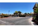 Gated entrance to Forest Hills community offers privacy, landscaping, and mature trees at 3928 Edgemoor Way, Las Vegas, NV 89121