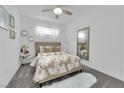 Cozy bedroom with plush carpet, a comfortable bed, and stylish decor at 4428 Mural Glen Ct, North Las Vegas, NV 89084