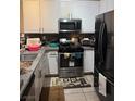 Functional kitchen with stainless steel appliances, granite countertops, and ample cabinet space, ready for cooking at 5161 Briar Meadow Way, Las Vegas, NV 89118