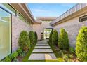 Inviting front entrance with manicured landscaping and a modern walkway at 641 Majestic Rim Dr, Henderson, NV 89012